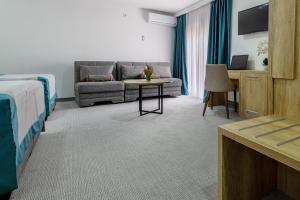 Postel nebo postele na pokoji v ubytování Hotel Porat