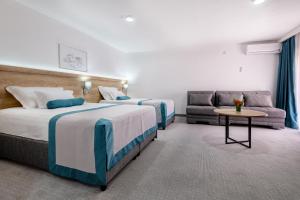 Postel nebo postele na pokoji v ubytování Hotel Porat