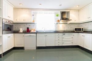 Kuchyň nebo kuchyňský kout v ubytování Apartamento Xixo
