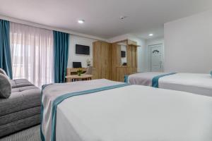 Postel nebo postele na pokoji v ubytování Hotel Porat