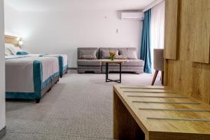 Postel nebo postele na pokoji v ubytování Hotel Porat