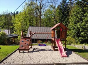 a playground with a slide at Chata Harmonie in Bedřichov