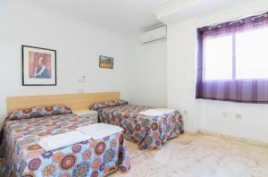 Postel nebo postele na pokoji v ubytování Apartamento Xixo