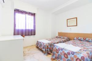 Postel nebo postele na pokoji v ubytování Apartamento Xixo