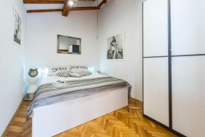 Posteľ alebo postele v izbe v ubytovaní Beach Lapad Apartment Villa Tolja