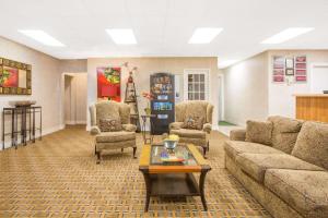 a living room with a couch and chairs and a table at Days Inn by Wyndham Chester in Chester