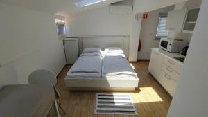 Postel nebo postele na pokoji v ubytování B&B Isola
