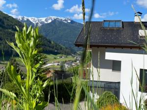 a view from a house with mountains in the background at Ferienwohnungen Landler in San Giovanni in Val Aurina