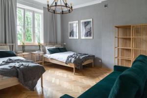 Posteľ alebo postele v izbe v ubytovaní Warsaw Concierge Filtrowa