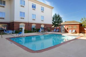 a swimming pool in front of a building at Holiday Inn Express Hotel & Suites Abilene Mall South by IHG in Abilene