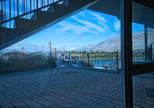 a view of the mountains from the balcony of a house at Alexis Motel & Apartments in Queenstown