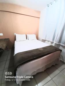 Cama ou camas em um quarto em Flats Bueno em Goiânia