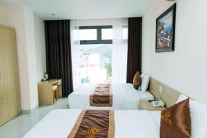 Ένα ή περισσότερα κρεβάτια σε δωμάτιο στο Khách sạn Misa