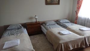 Postel nebo postele na pokoji v ubytování Agroturystyka Przy Stawie