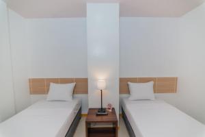 Voodi või voodid majutusasutuse Soi Suites toas