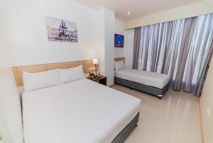 Voodi või voodid majutusasutuse Soi Suites toas
