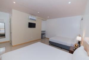 Voodi või voodid majutusasutuse Soi Suites toas