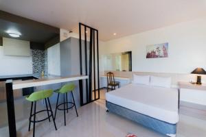 Voodi või voodid majutusasutuse Soi Suites toas