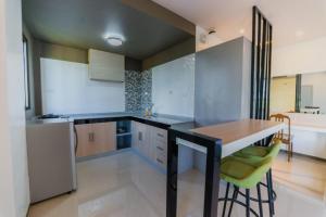 A kitchen or kitchenette at Soi Suites