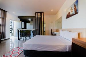 Voodi või voodid majutusasutuse Soi Suites toas