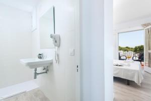 Postel nebo postele na pokoji v ubytování Hostal Talamanca