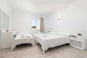 Postel nebo postele na pokoji v ubytování Hostal Talamanca
