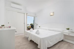 Postel nebo postele na pokoji v ubytování Hostal Talamanca