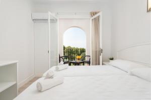 Postel nebo postele na pokoji v ubytování Hostal Talamanca