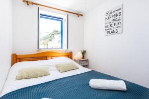 Postel nebo postele na pokoji v ubytování Casa Pedro Burgau