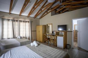 Säng eller sängar i ett rum på Bolivia Lodge