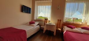 Łóżko lub łóżka w pokoju w obiekcie Słoneczny Dom pokoje i apartament na wynajem