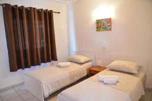 Postel nebo postele na pokoji v ubytování Apartments Lonić