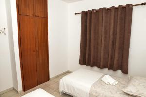 Postel nebo postele na pokoji v ubytování Apartments Lonić