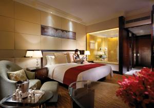 A bed or beds in a room at StarWorld Hotel
