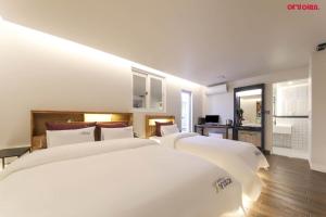 Postelja oz. postelje v sobi nastanitve Hotel Yeogijoa