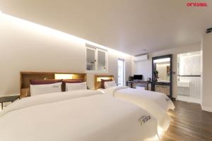 Postel nebo postele na pokoji v ubytování Hotel Yeogijoa