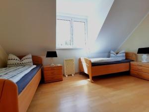 Ένα ή περισσότερα κρεβάτια σε δωμάτιο στο Ferienhaus am Darß