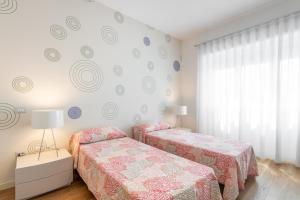Posteľ alebo postele v izbe v ubytovaní A Luxury apartment at Cagliari Poetto Beachfront