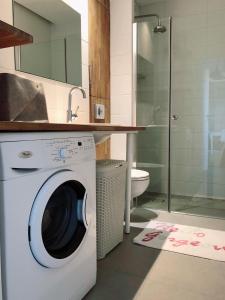 a washing machine in a bathroom with a sink at Seaview Apartament z Balkonem i Widokiem na Morze in Sopot