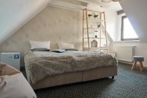 
Łóżko lub łóżka w pokoju w obiekcie Armada Apart Ustka
