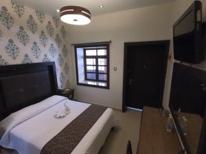 TV a/nebo společenská místnost v ubytování Hotel San Diego
