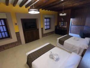 Postel nebo postele na pokoji v ubytování Hotel San Diego