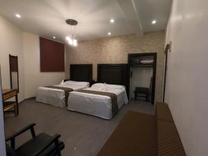 Postel nebo postele na pokoji v ubytování Hotel San Diego