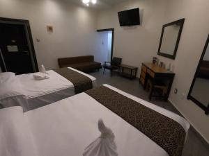 Postel nebo postele na pokoji v ubytování Hotel San Diego