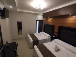 Postel nebo postele na pokoji v ubytování Hotel San Diego