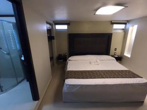 Postel nebo postele na pokoji v ubytování Hotel San Diego