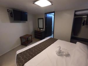 Postel nebo postele na pokoji v ubytování Hotel San Diego