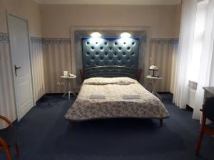 Postel nebo postele na pokoji v ubytování Hotel Marmułowski