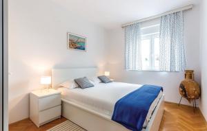 Posteľ alebo postele v izbe v ubytovaní Apartman Crikvenica