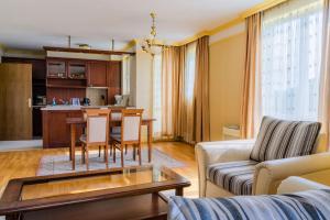 a living room with a couch and a table at ApartComplex Splendid in St. St. Constantine and Helena